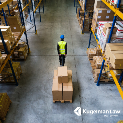 A busy Fresno logistics warehouse facing an EDD payroll tax and worker misclassification audit.